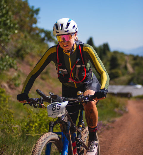 Charlotte riding mountain bike in ultra endurance event