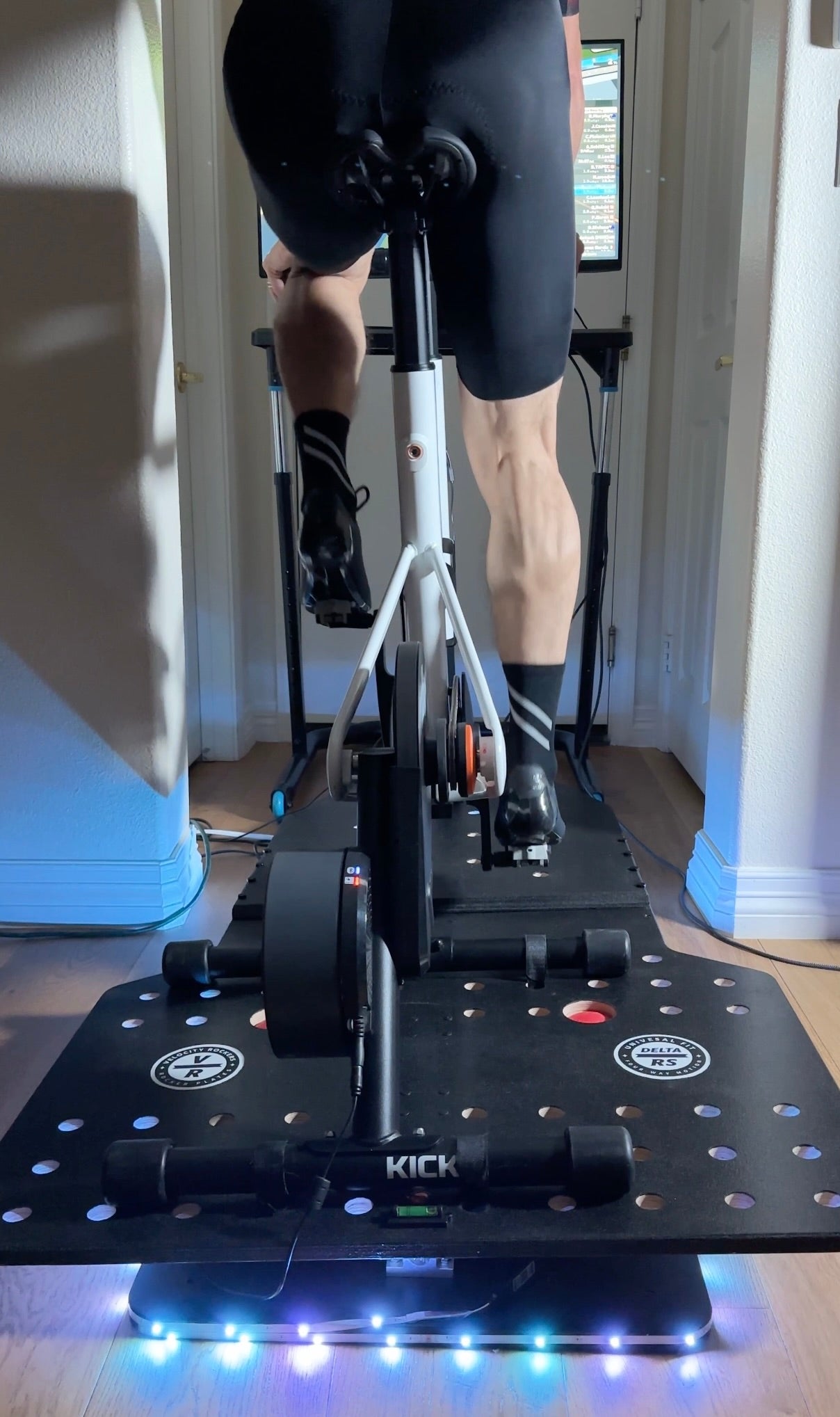 Cyclist training on Zwift Ride and Delta RS rocker plate 
