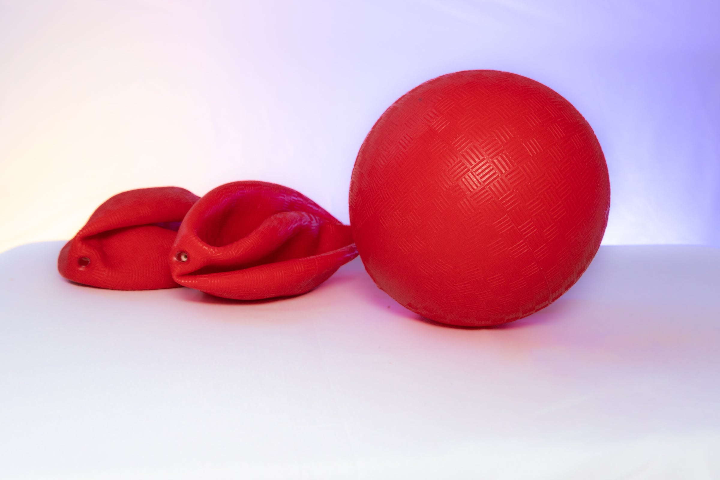 Red five-inch playground balls.