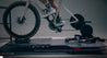 A Wahoo KICKR indoor trainer on Delta RS Rocker Plate with full-motion movement for realistic Zwift rides and indoor cycling