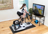 Woman indoor cycling on Zwift with Specialized bike, Tacx Neo 2T trainer on top of Velocity Rocker rocker plate.
