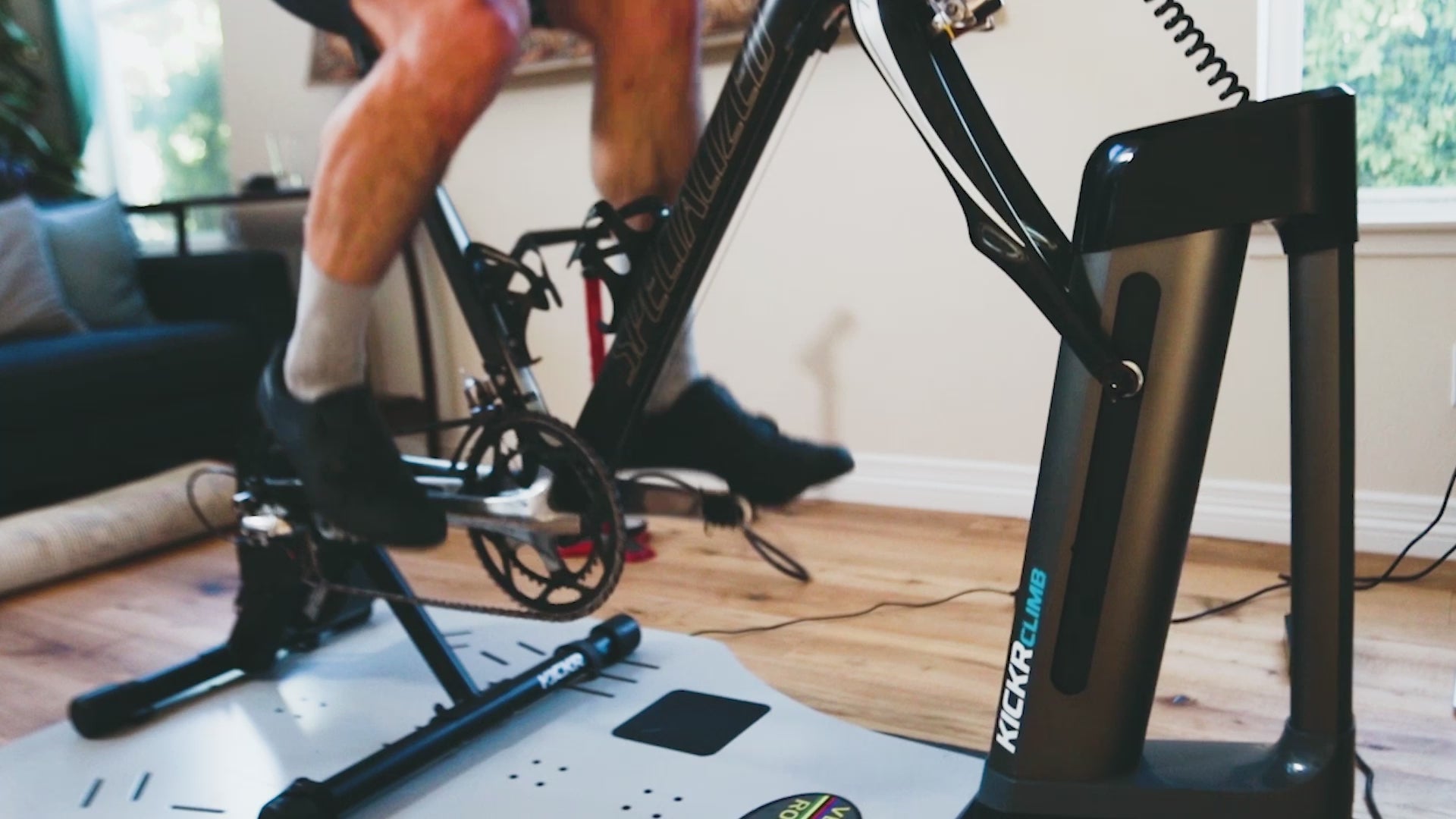 Indoor cycling on a Specialized bike using the Kickr Core and Kickr Climb on top of the Velocity Rocker rocker plate. Vertical motion of the Kickr Climb shown.