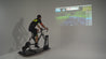 Man riding Specialized bike and Wahoo Kickr Core and Kickr Climb on top of the Velocity Rocker rocker plate using Zwift in white space.