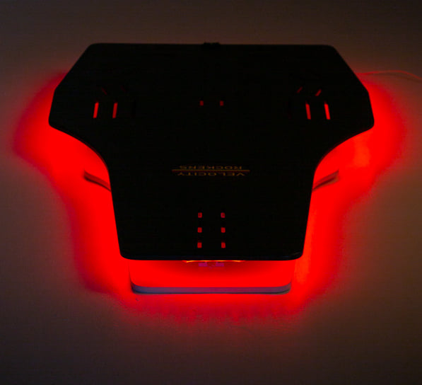 Velocity Rocker rocker plate lit up with red LED lights.